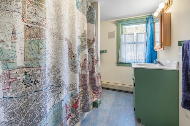 bathroom with vanity and a baseboard heating unit