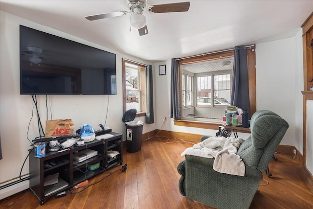 49 Eastern Ave, Richford, VT 05476 - living room with ceiling fan, a baseboard radiator, and wood-type flooring