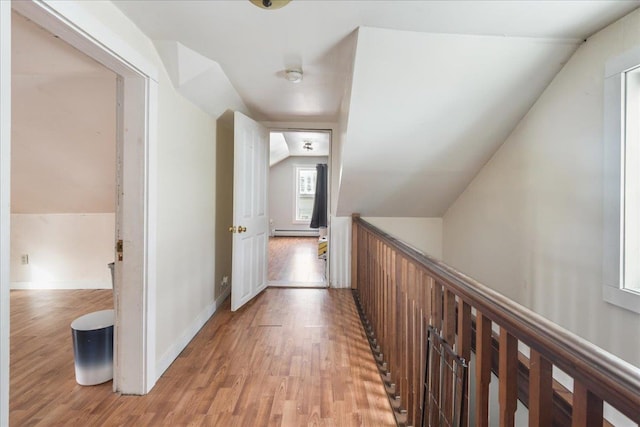49 Eastern Ave, Richford, VT 05476 - hall featuring light hardwood / wood-style floors, lofted ceiling, and a baseboard heating unit