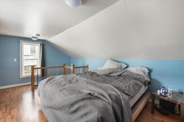 49 Eastern Ave, Richford, VT 05476 - bedroom with hardwood / wood-style floors and vaulted ceiling