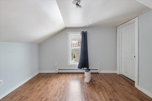 49 Eastern Ave, Richford, VT 05476 - additional living space with wood-type flooring, vaulted ceiling, and baseboard heating