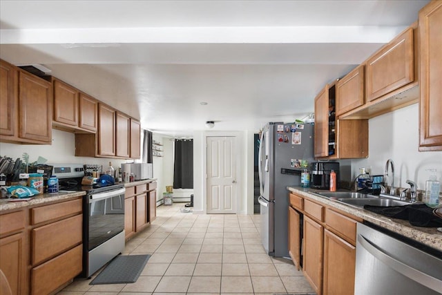 49 Eastern Ave, Richford, VT 05476 - kitchen with sink, light tile patterned floors, and appliances with stainless steel finishes