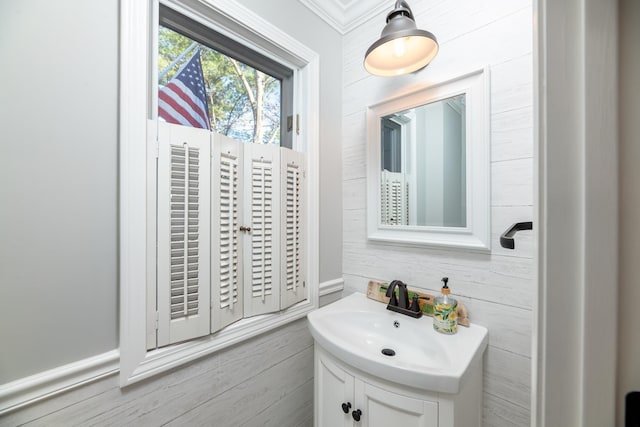 bathroom featuring vanity and ornamental molding