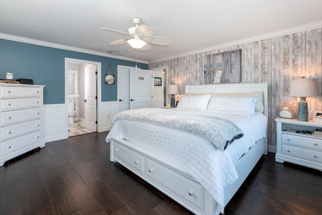 bedroom featuring ensuite bath, ceiling fan, dark hardwood / wood-style flooring, and ornamental molding