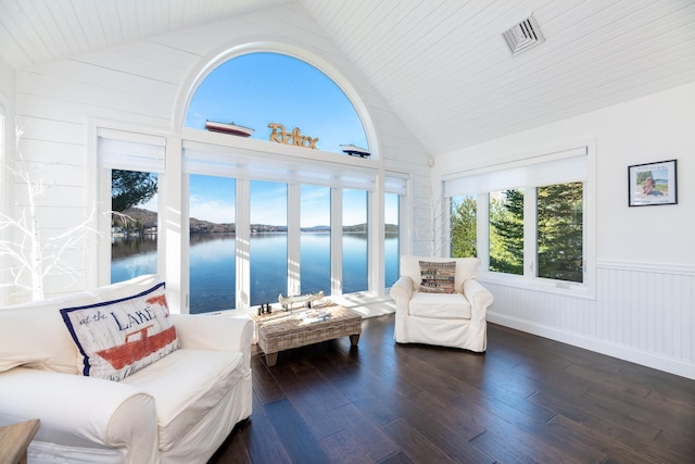 sunroom with a water view and vaulted ceiling