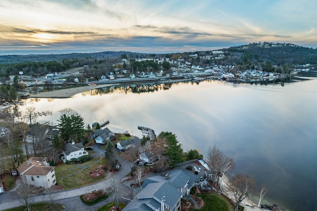 aerial view at dusk with a water view