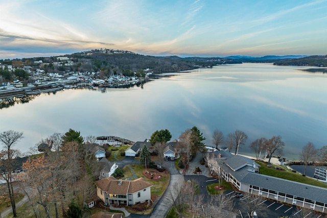 aerial view at dusk with a water view