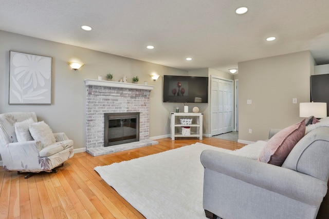 living room featuring a fireplace and hardwood / wood-style flooring