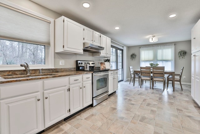 kitchen featuring stainless steel electric stove, sink, and white cabinets