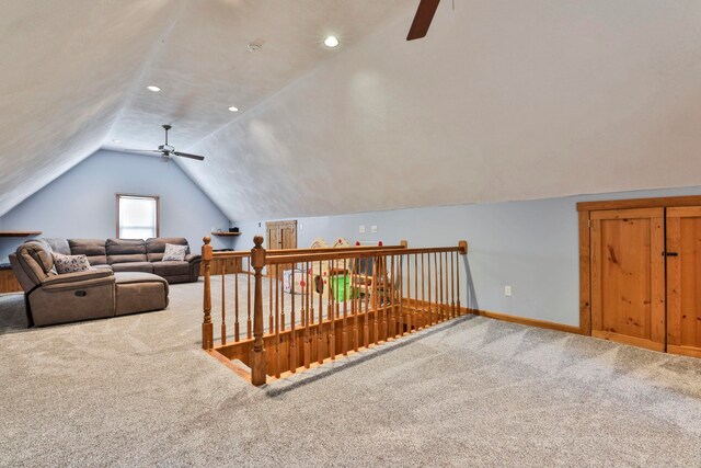 additional living space with carpet, ceiling fan, and lofted ceiling