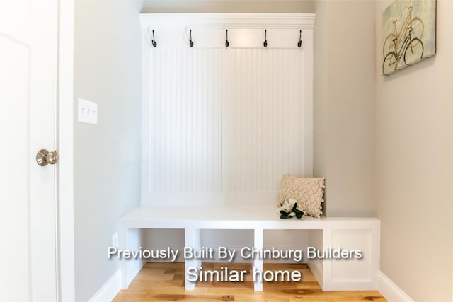 mudroom with light hardwood / wood-style floors