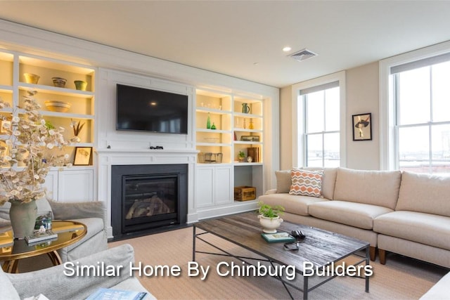 living room featuring built in shelves