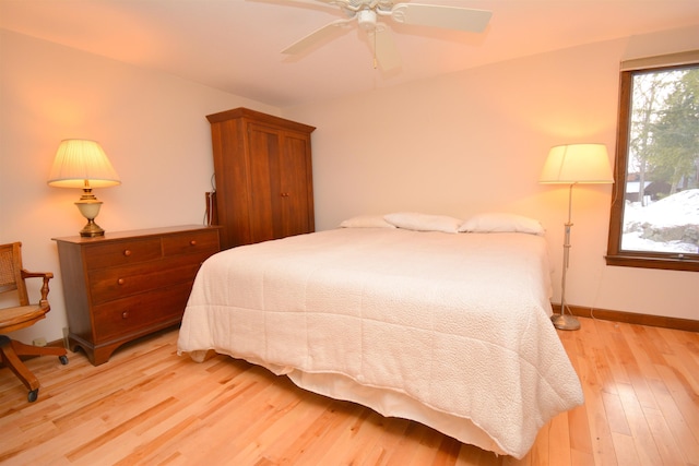 bedroom featuring ceiling fan and light hardwood / wood-style flooring