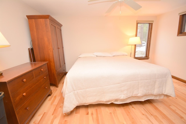 bedroom with ceiling fan and light hardwood / wood-style flooring