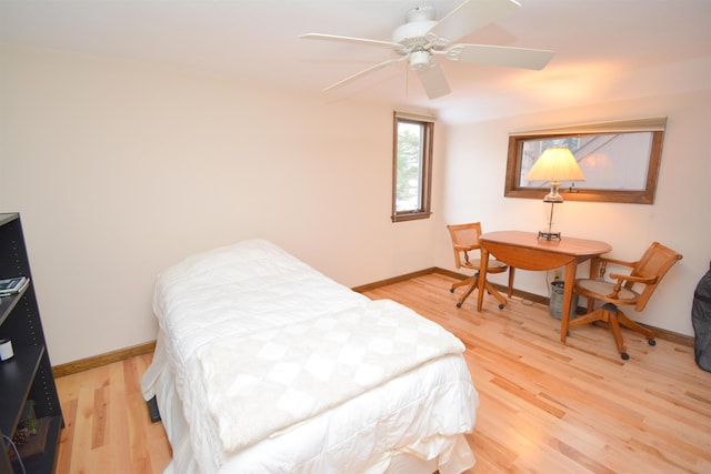 bedroom with ceiling fan and wood-type flooring