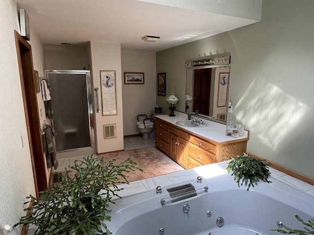 bathroom featuring tile patterned floors, independent shower and bath, and vanity