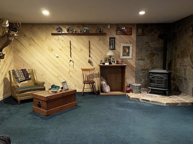 137 Modock Hill Rd, Conway, NH 03818 - carpeted living area with a wood stove, wooden walls, and recessed lighting