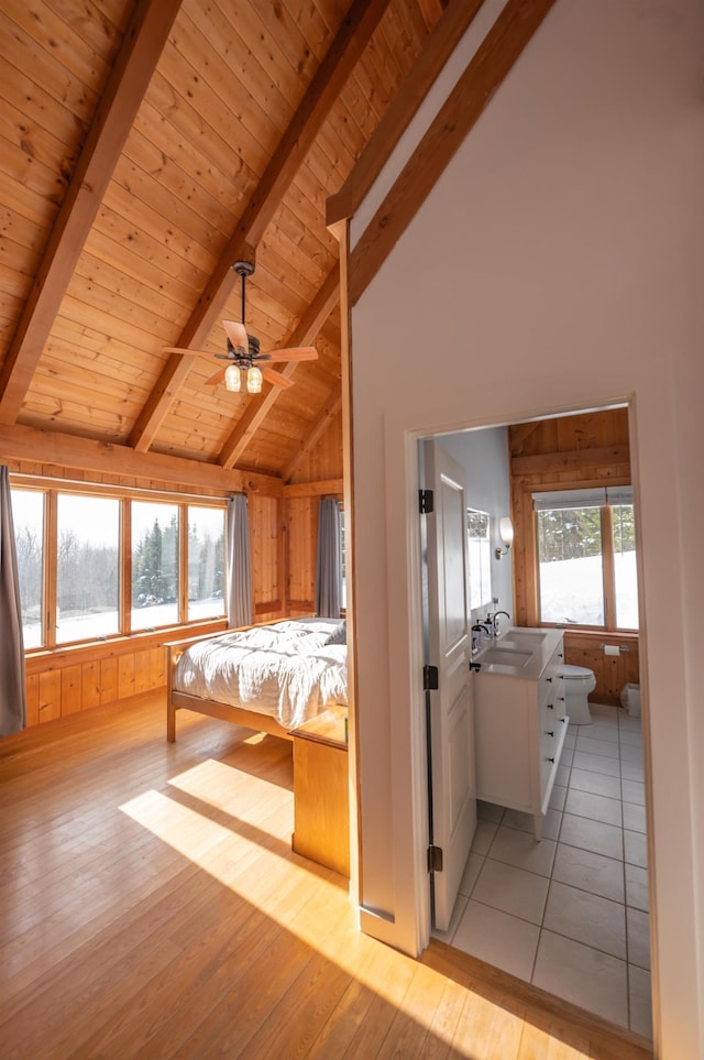 43 Upton Rd, Dover, VT 05356 - unfurnished bedroom with a wooden ceiling with exposed beams, light wood-style floors, high vaulted ceiling, and wooden walls