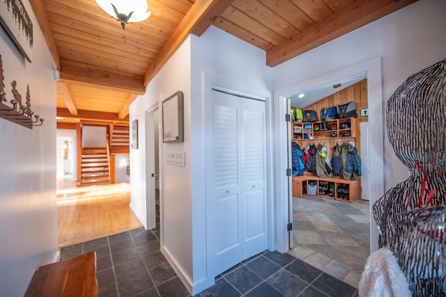 43 Upton Rd, Dover, VT 05356 - corridor with a wooden ceiling with exposed beams, stairs, and dark stone finish flooring