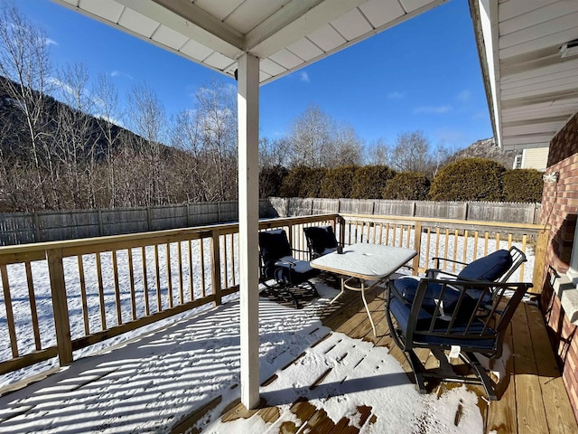 view of snow covered deck