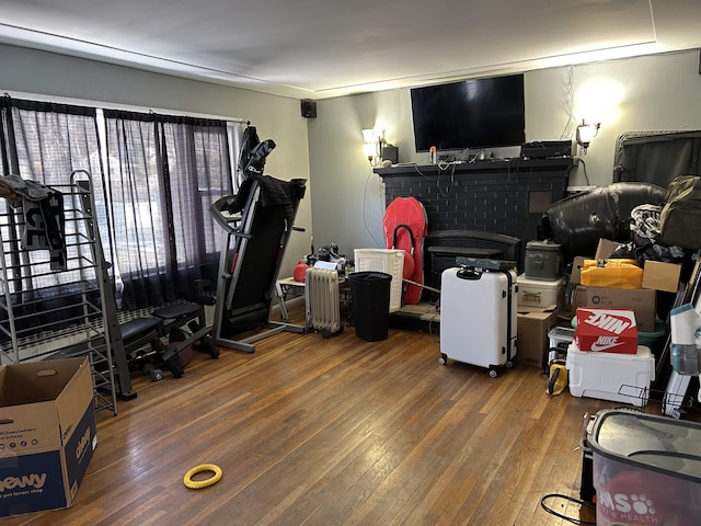 exercise room with dark hardwood / wood-style floors