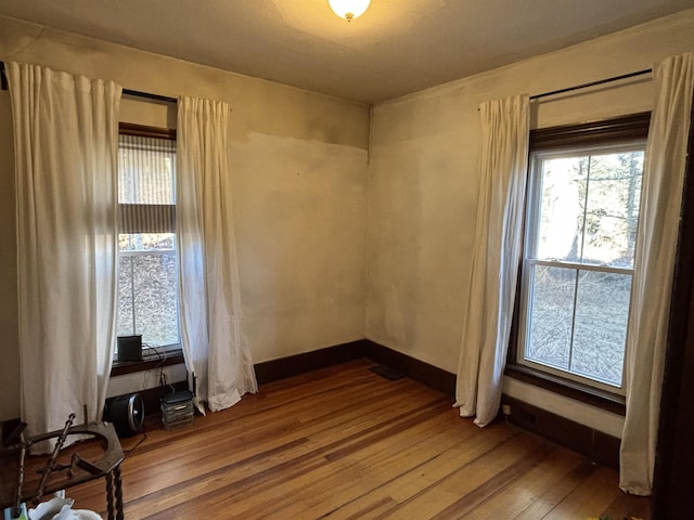 spare room featuring hardwood / wood-style flooring