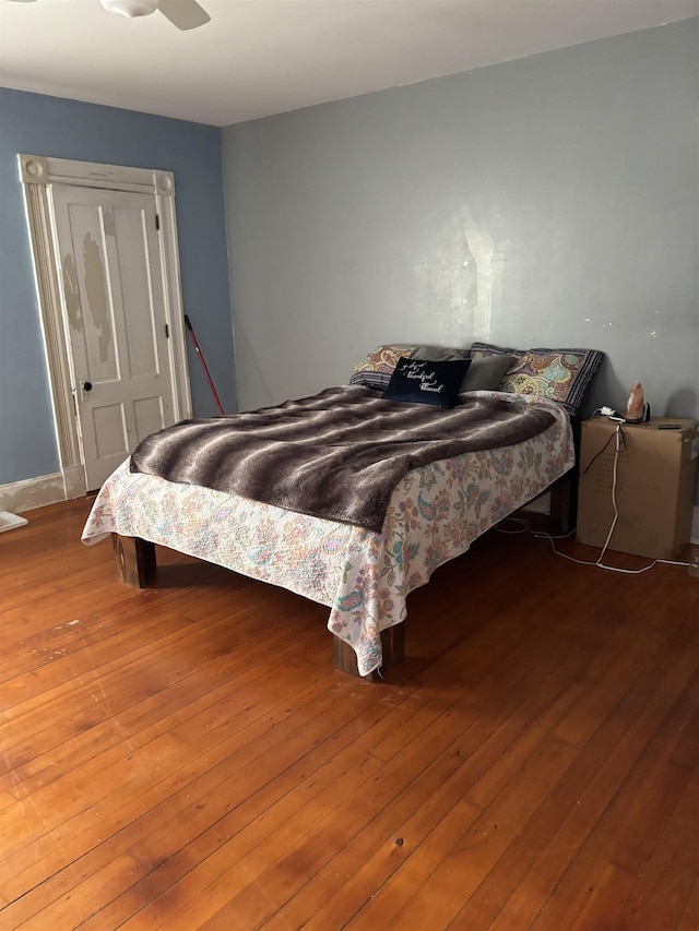 bedroom with hardwood / wood-style flooring and ceiling fan