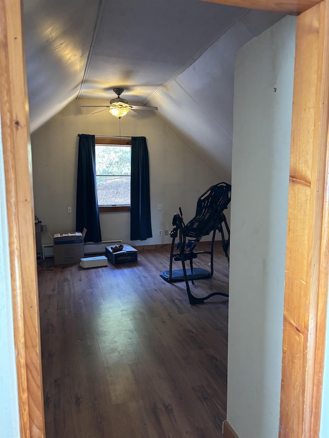 interior space with dark hardwood / wood-style flooring, ceiling fan, and lofted ceiling