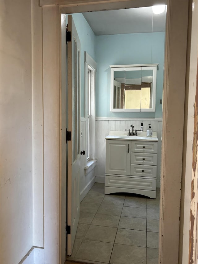 bathroom with tile patterned floors and vanity