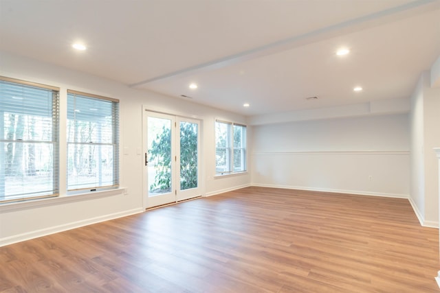 spare room with light wood-type flooring