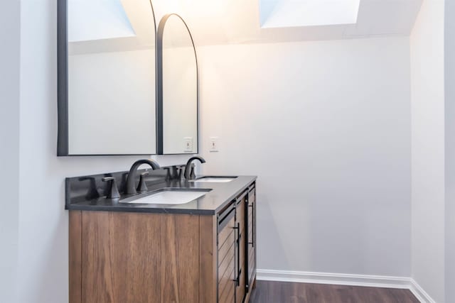 bathroom featuring wood-type flooring and vanity