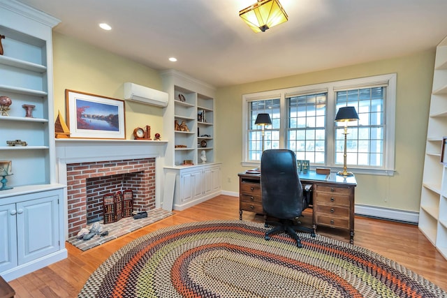 office area with a wall mounted air conditioner, light wood-type flooring, a brick fireplace, and a baseboard heating unit