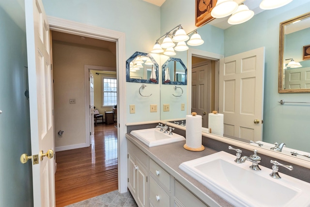 bathroom with tile patterned floors and vanity