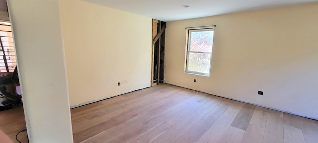 empty room with light hardwood / wood-style floors