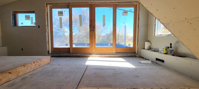 additional living space featuring lofted ceiling