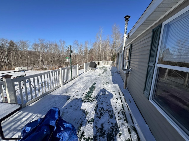 view of snow covered deck