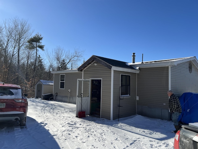 exterior space with a storage shed