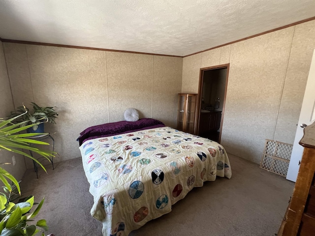 carpeted bedroom featuring a textured ceiling