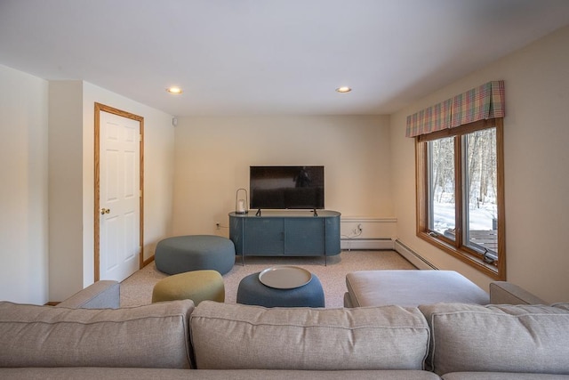 carpeted living room featuring a baseboard radiator