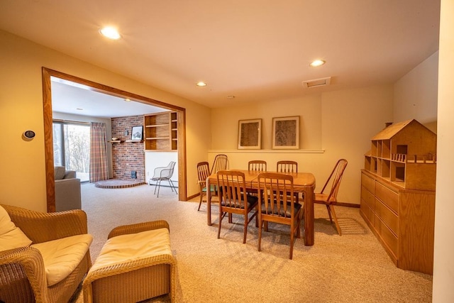 dining space with light colored carpet