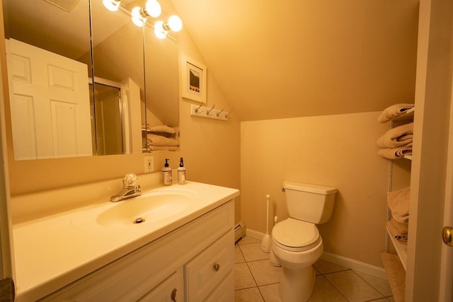 bathroom with tile patterned flooring, vanity, vaulted ceiling, and toilet