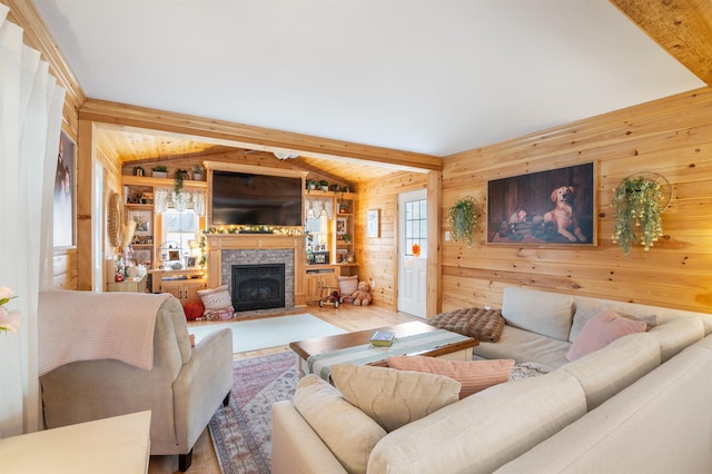 living room featuring vaulted ceiling with beams, wood walls, and light wood-type flooring