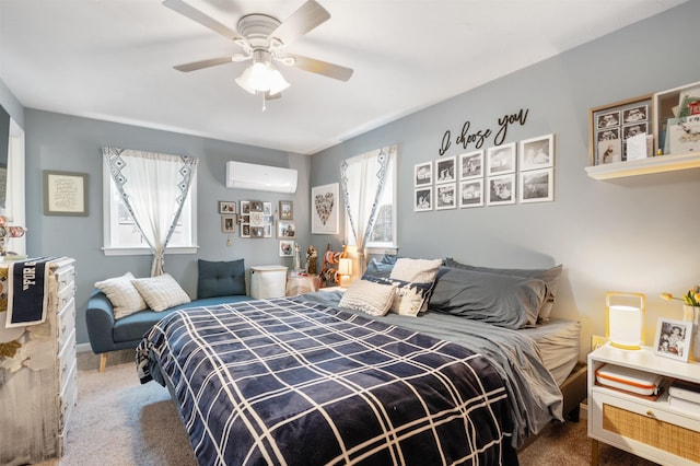 bedroom featuring ceiling fan, carpet floors, and a wall mounted AC