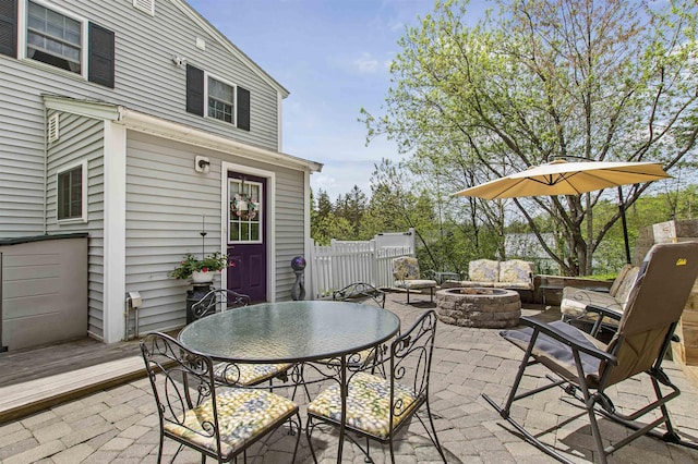 view of patio / terrace featuring an outdoor living space with a fire pit