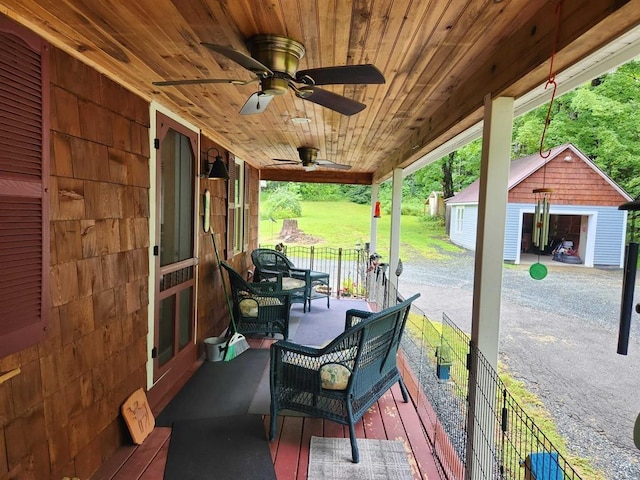 view of patio featuring a garage and an outdoor structure