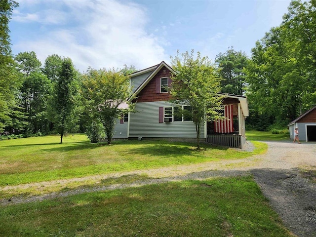 view of side of property featuring a lawn