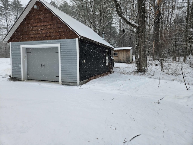 view of snow covered garage