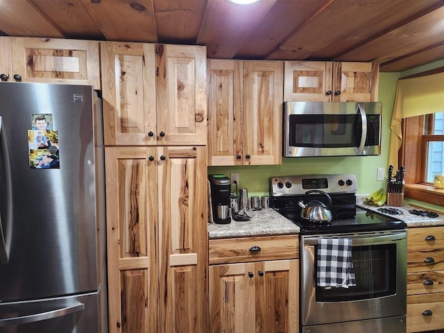 kitchen featuring light brown cabinets, wooden ceiling, and appliances with stainless steel finishes