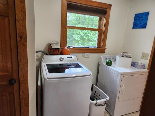 washroom featuring washer and clothes dryer