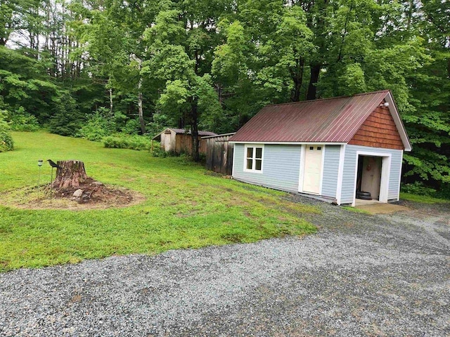 garage featuring a lawn